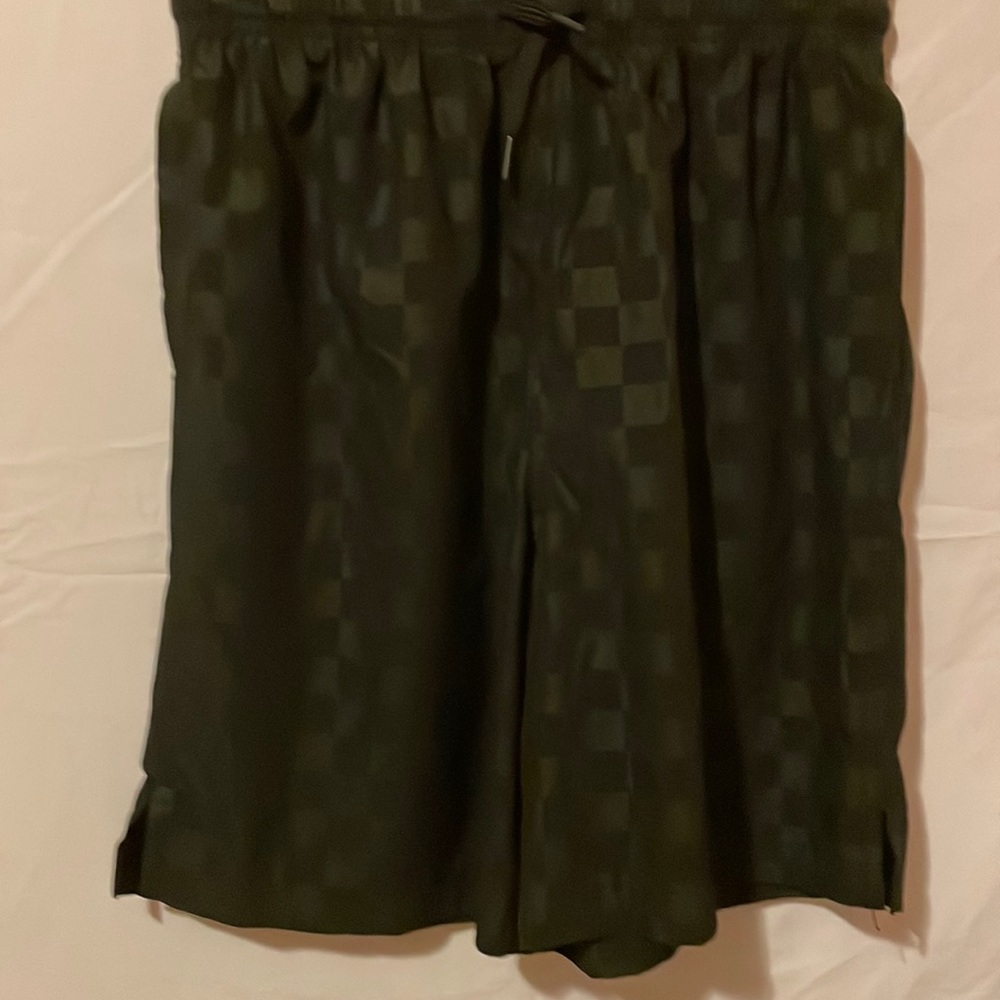 Black shorts with a drawstring waist.